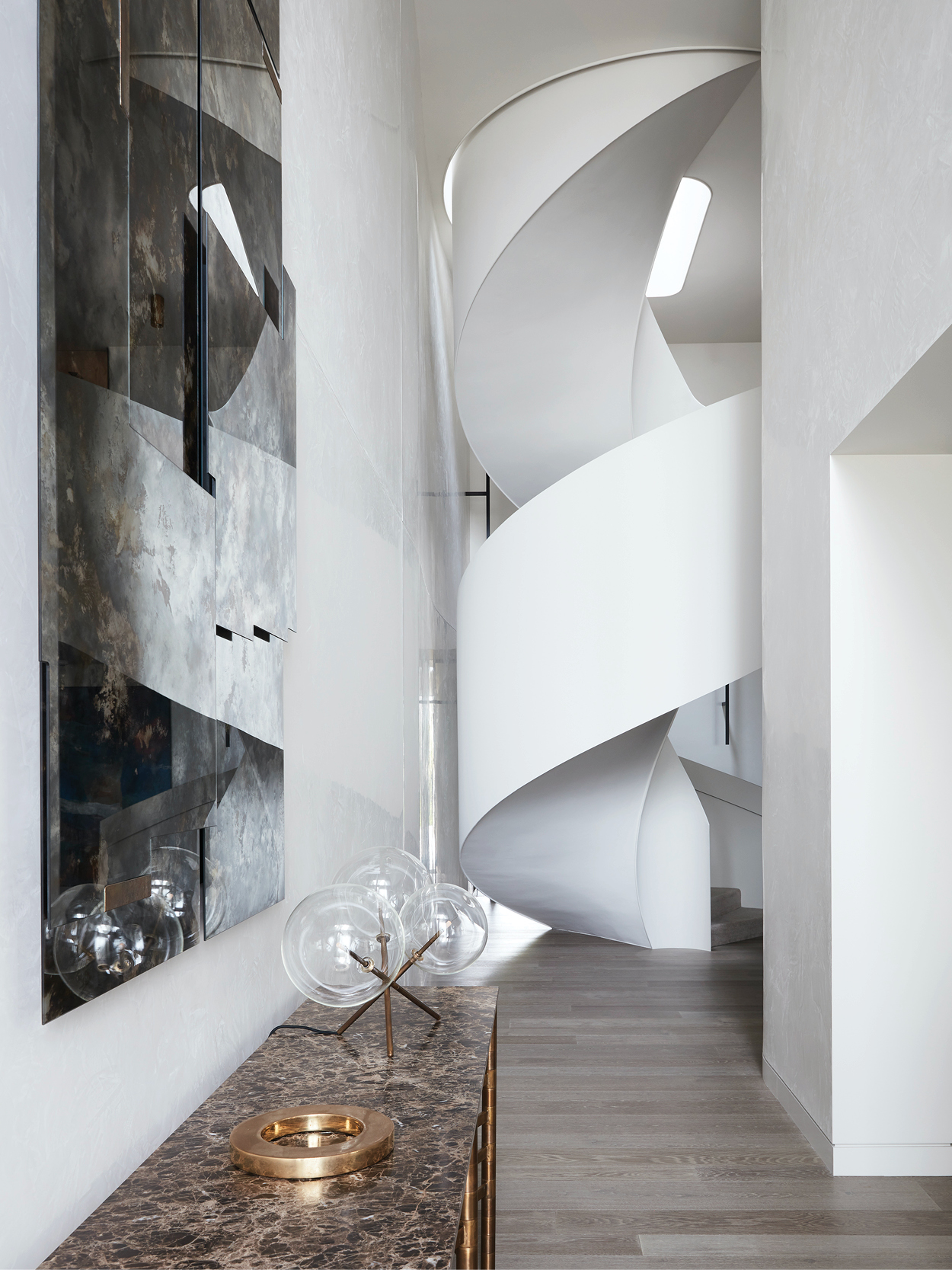This light-filled home plays with bold curvature to create refined ...